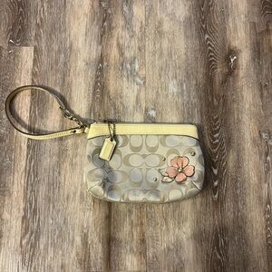 Coach Beige Wristlet with Yellow Trim and Floral Detail
